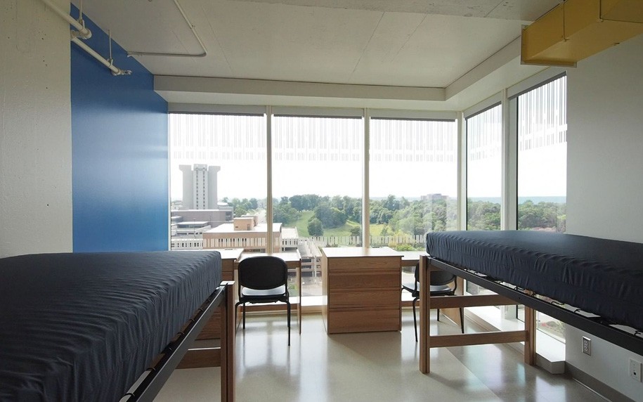 Loft beds, desks, and dressers in Morgens Hall room