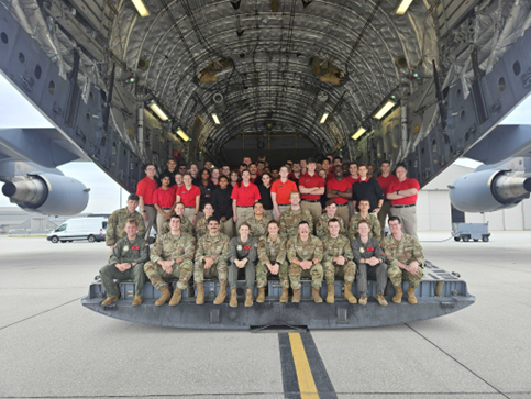 members of AirForce ROTC standing next to an airplane
