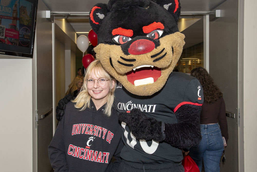 student with bearcat mascot