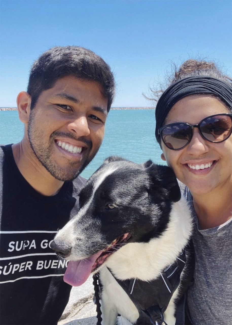 Shawna with her husband and dog on the beach