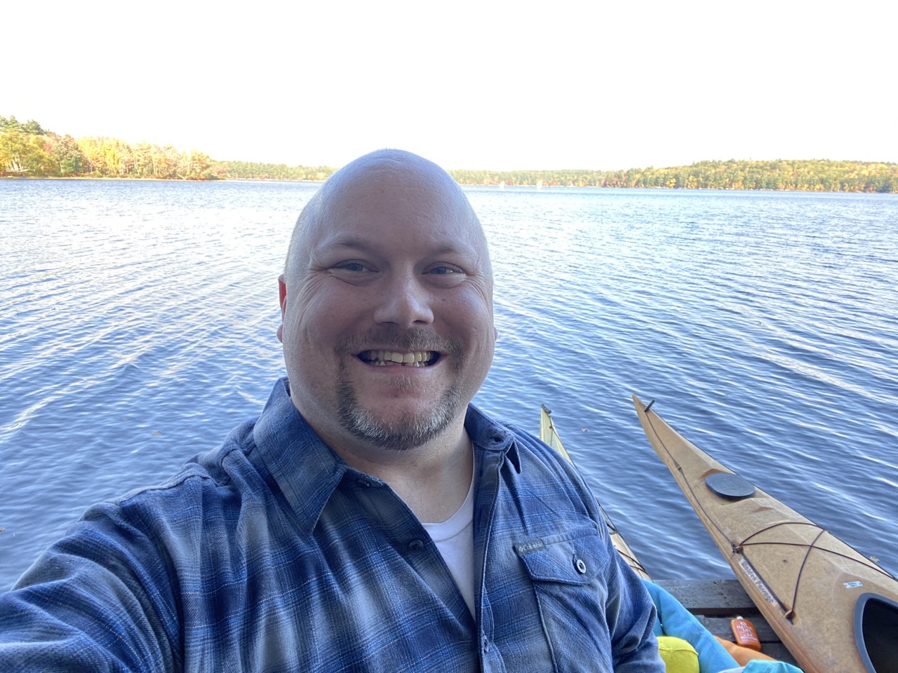 Man posing in Maine on a boat