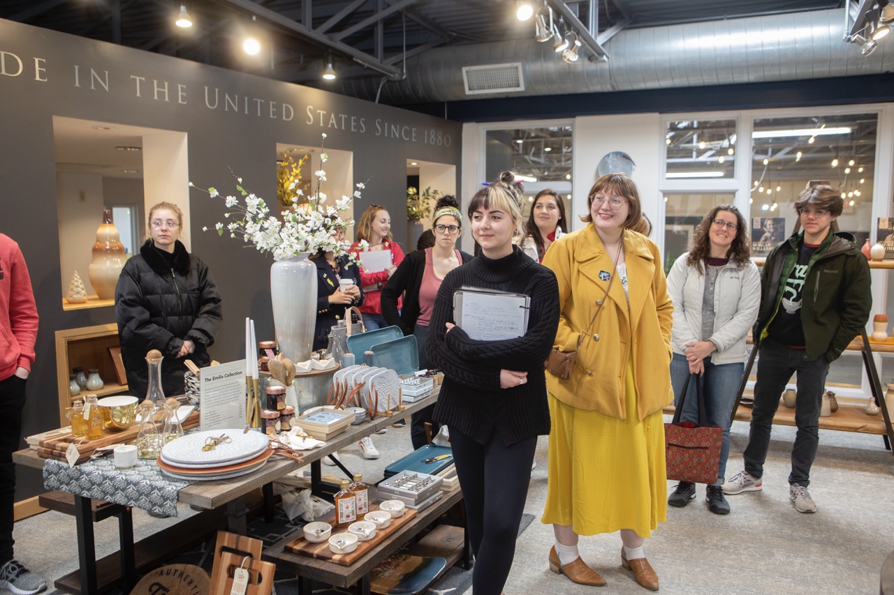 Group of students smiling in a museum