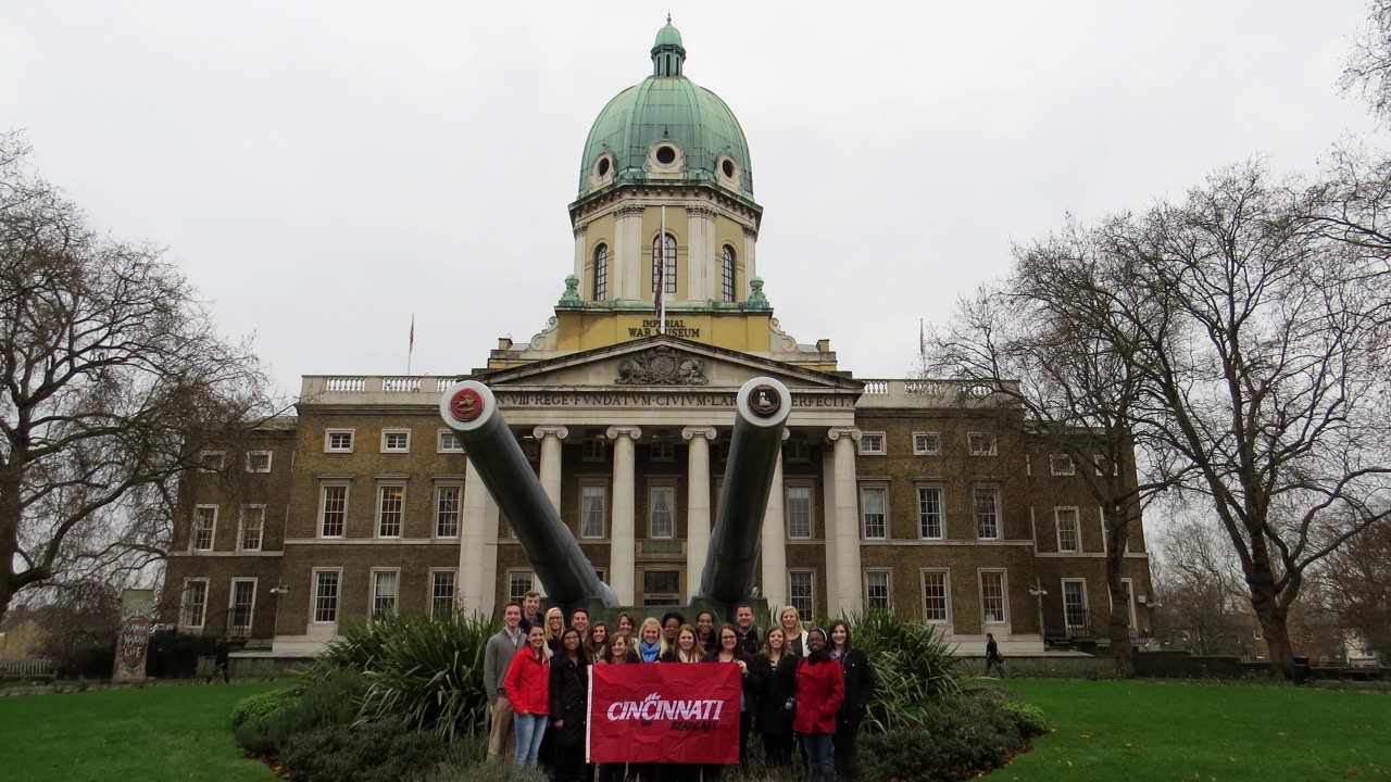 Students standing in front of a historic building 