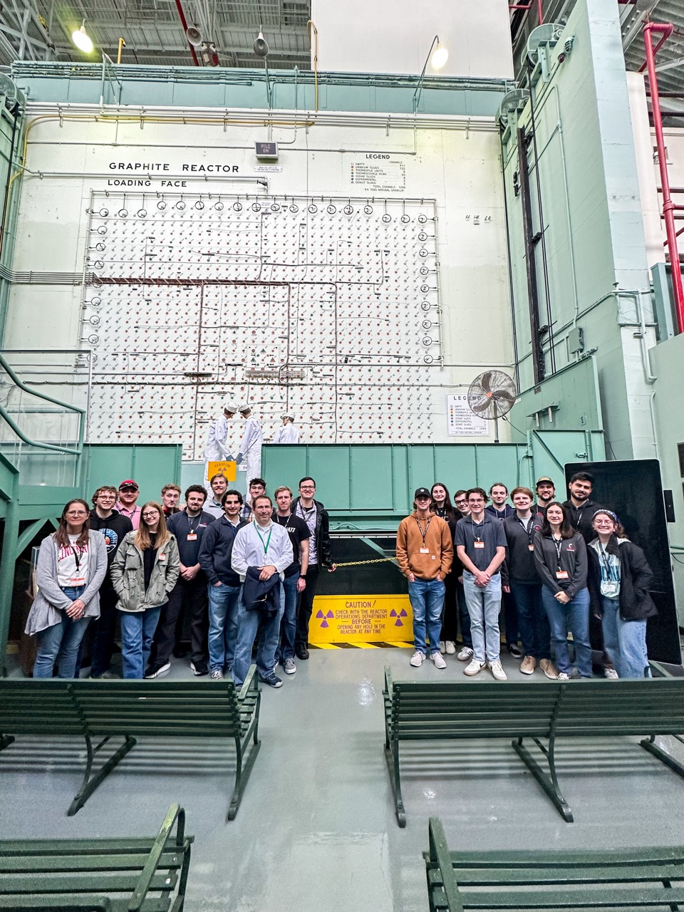 Students standing in the Oak Ridge Laboratory