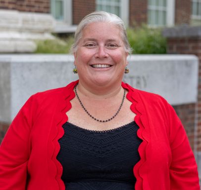 Amy standing outside of the CEAS building, smiling.
