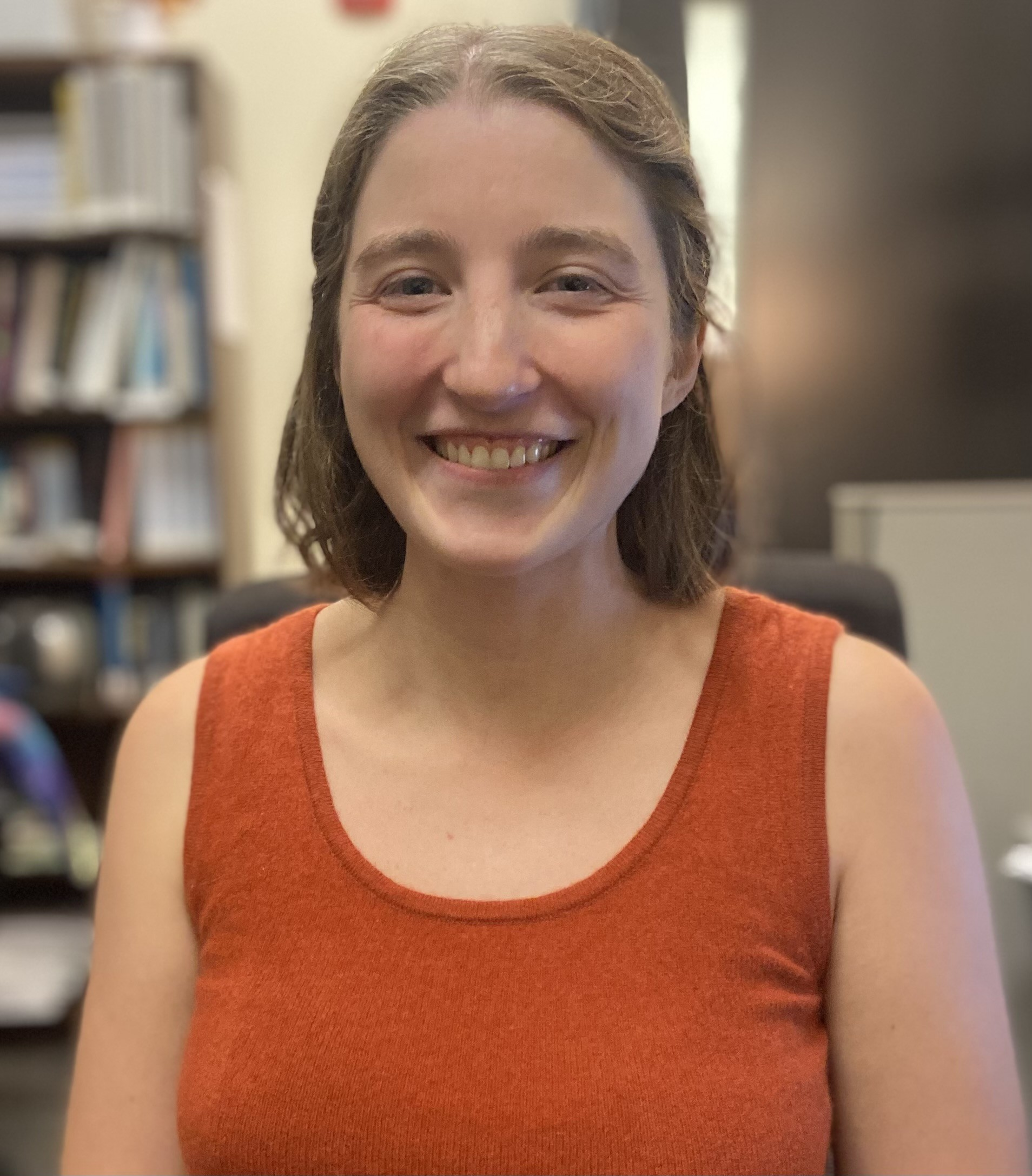 Sabrina smiling in her office