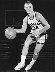 Larry Elsasser in basketball uniform, dribbling ball