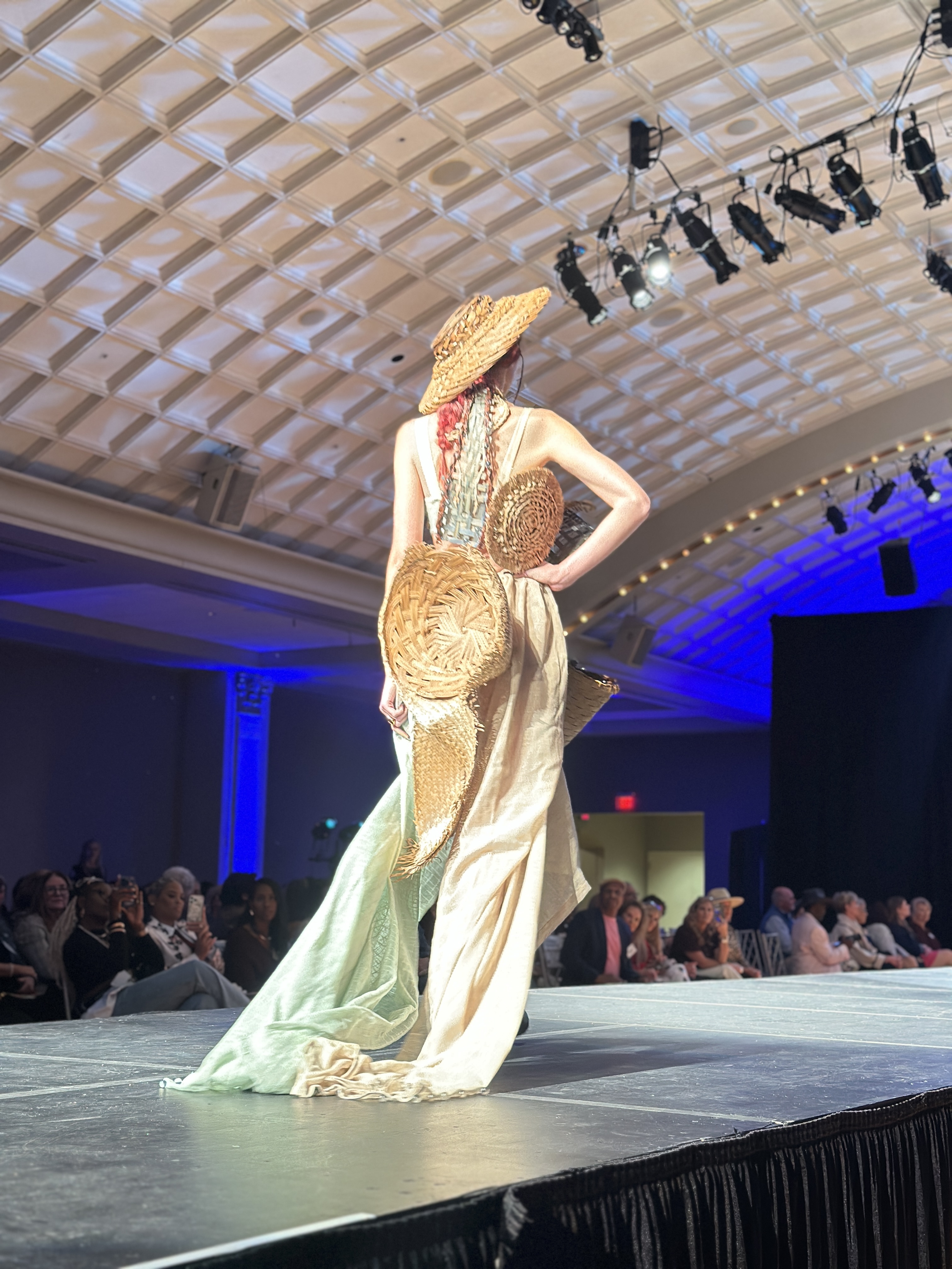 The back view of model wearing outfit made of thrifted baskets 