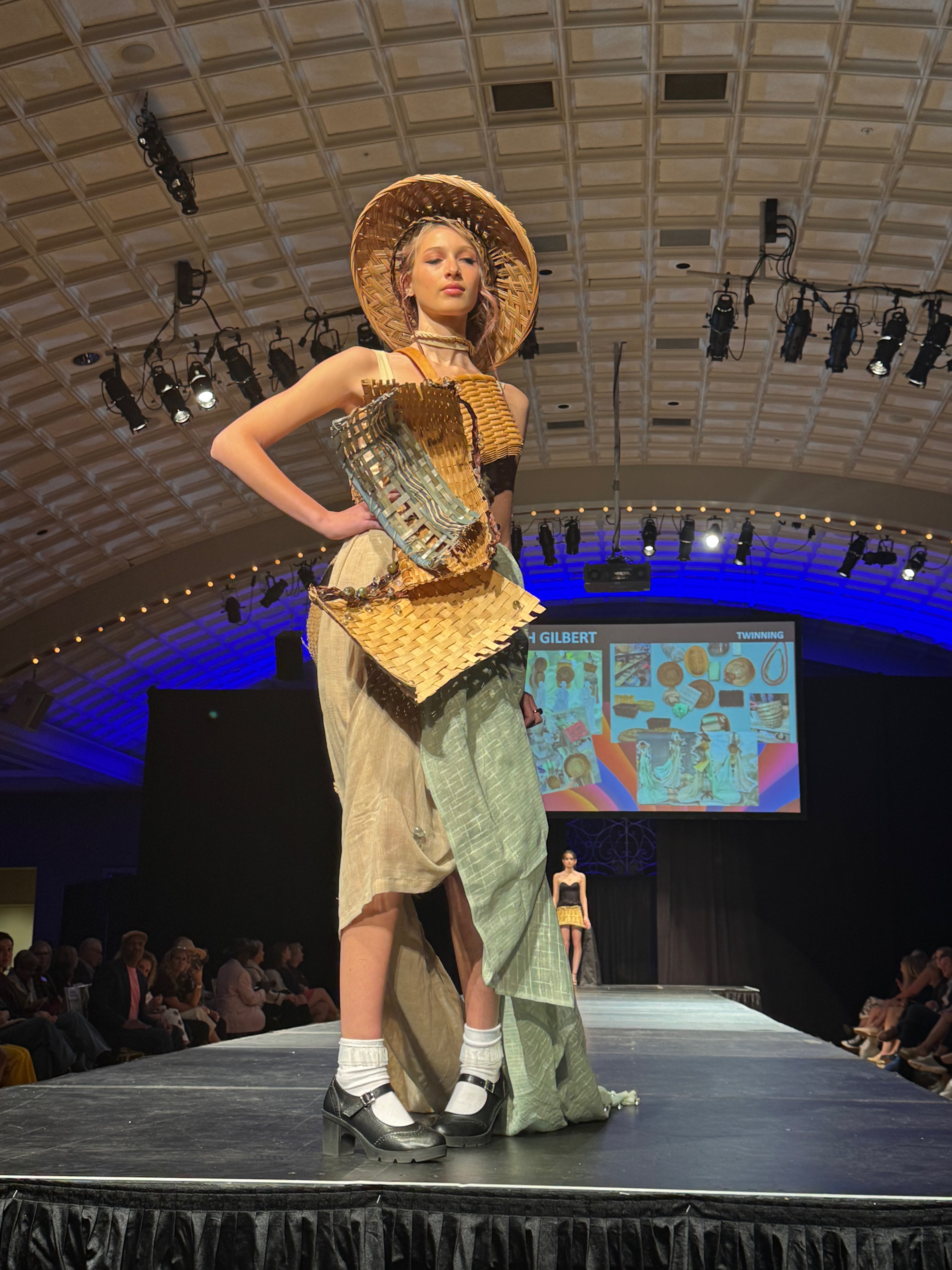 Model wearing outfit made of thrifted baskets