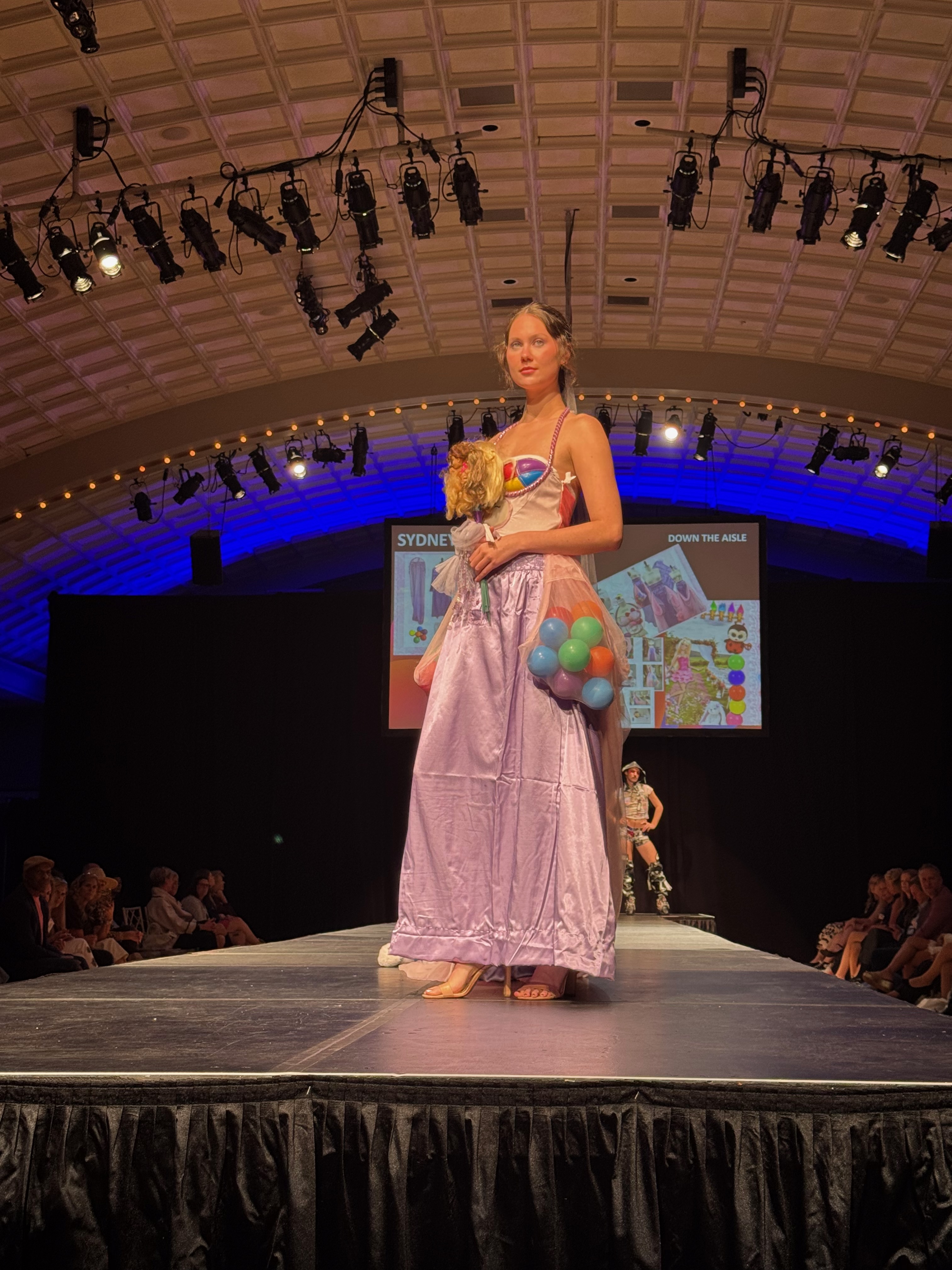 model wearing pink long skirt made from thrifted items 