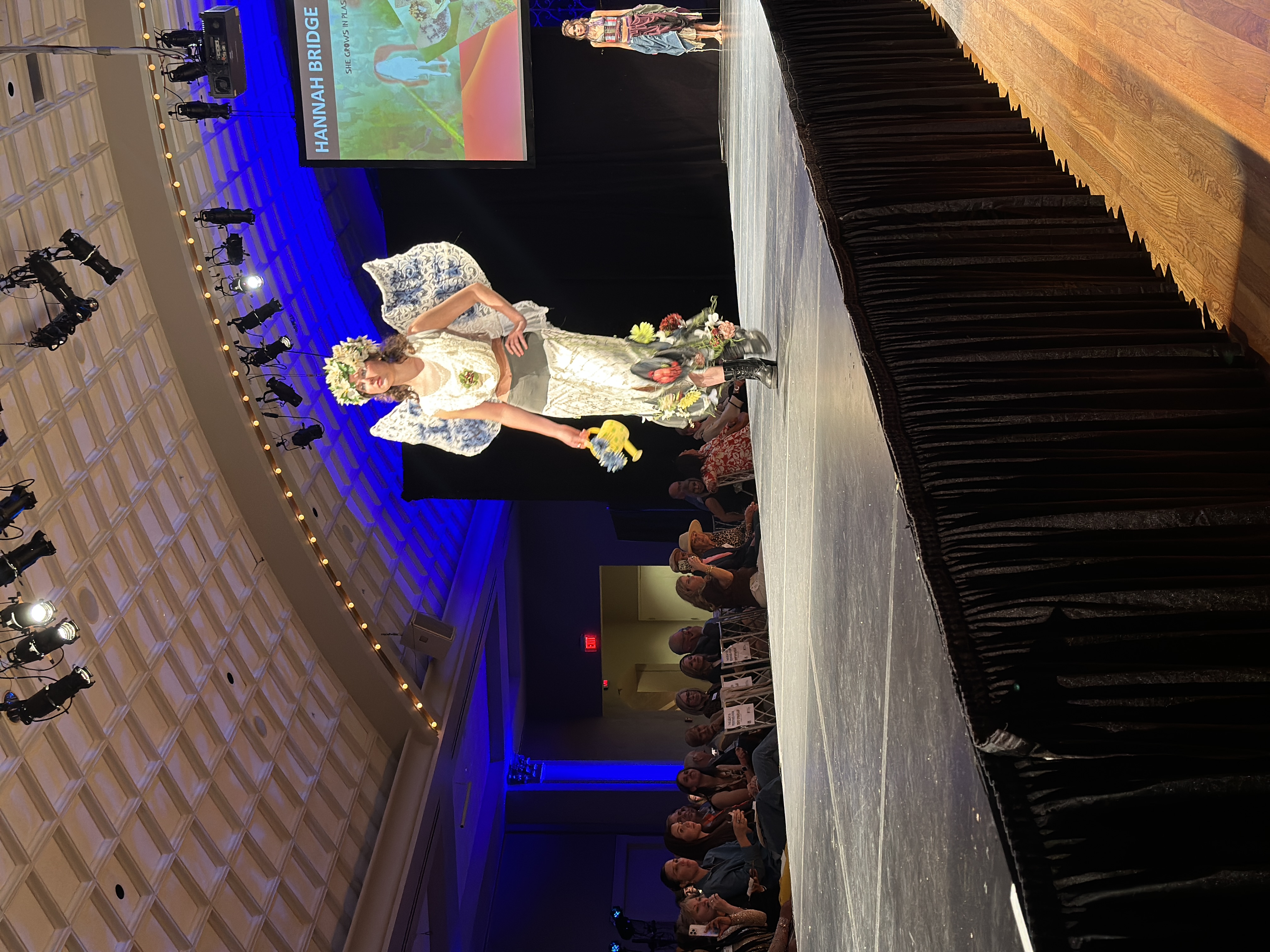 model wearing white ensemble with wings made from thrifted items