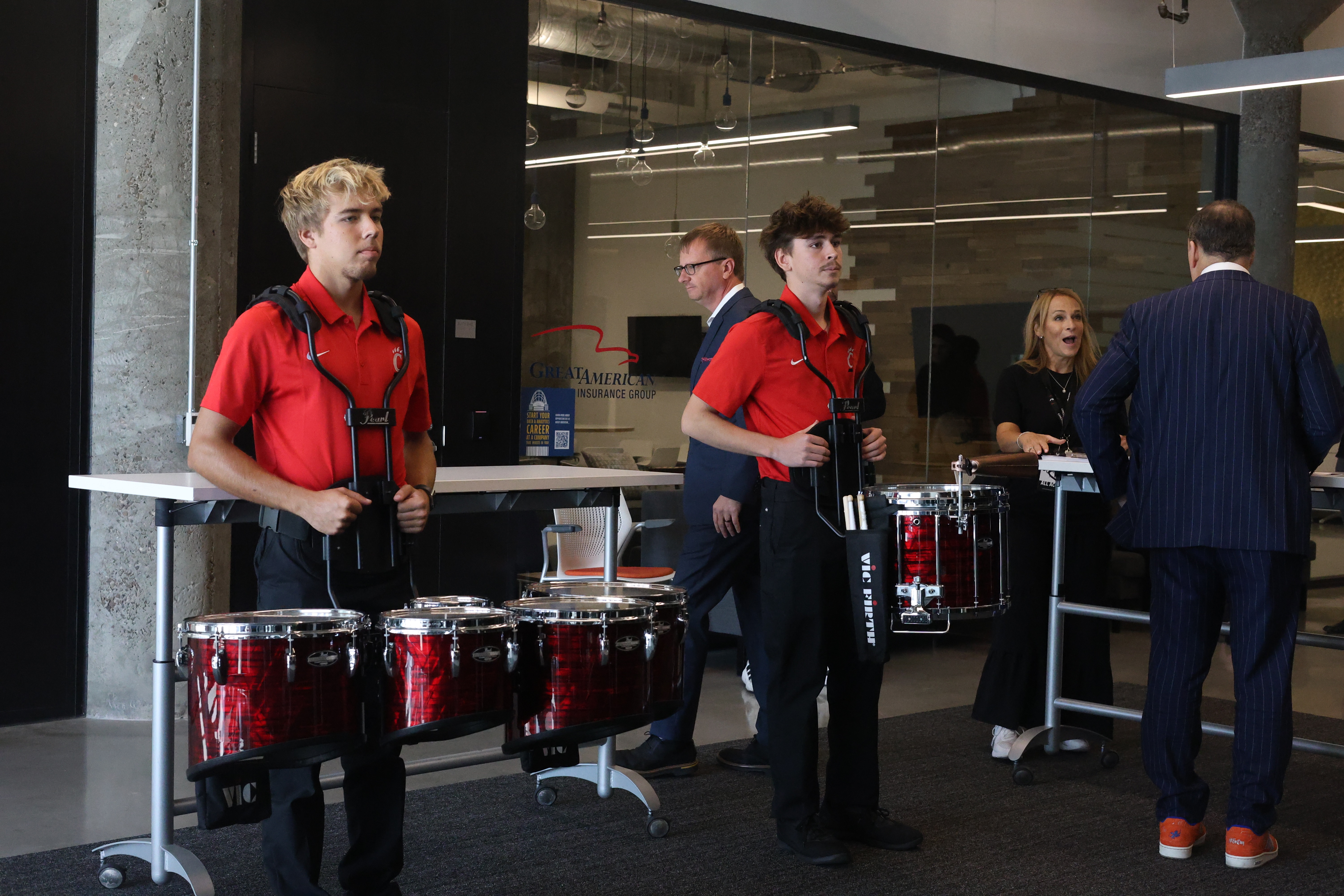 Drummers from UC Marching Band lead the honorees. Photo/Mia Rohrer