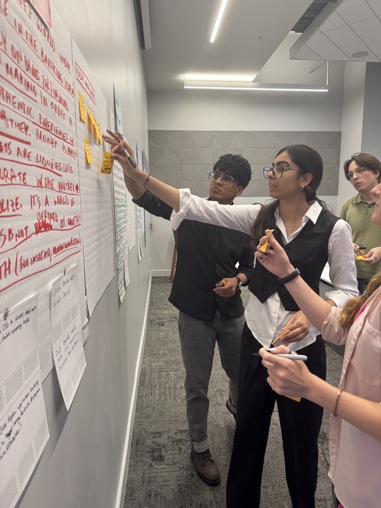 Scholars from NIS prepare for their presentation. Photo/Sydney Mauk