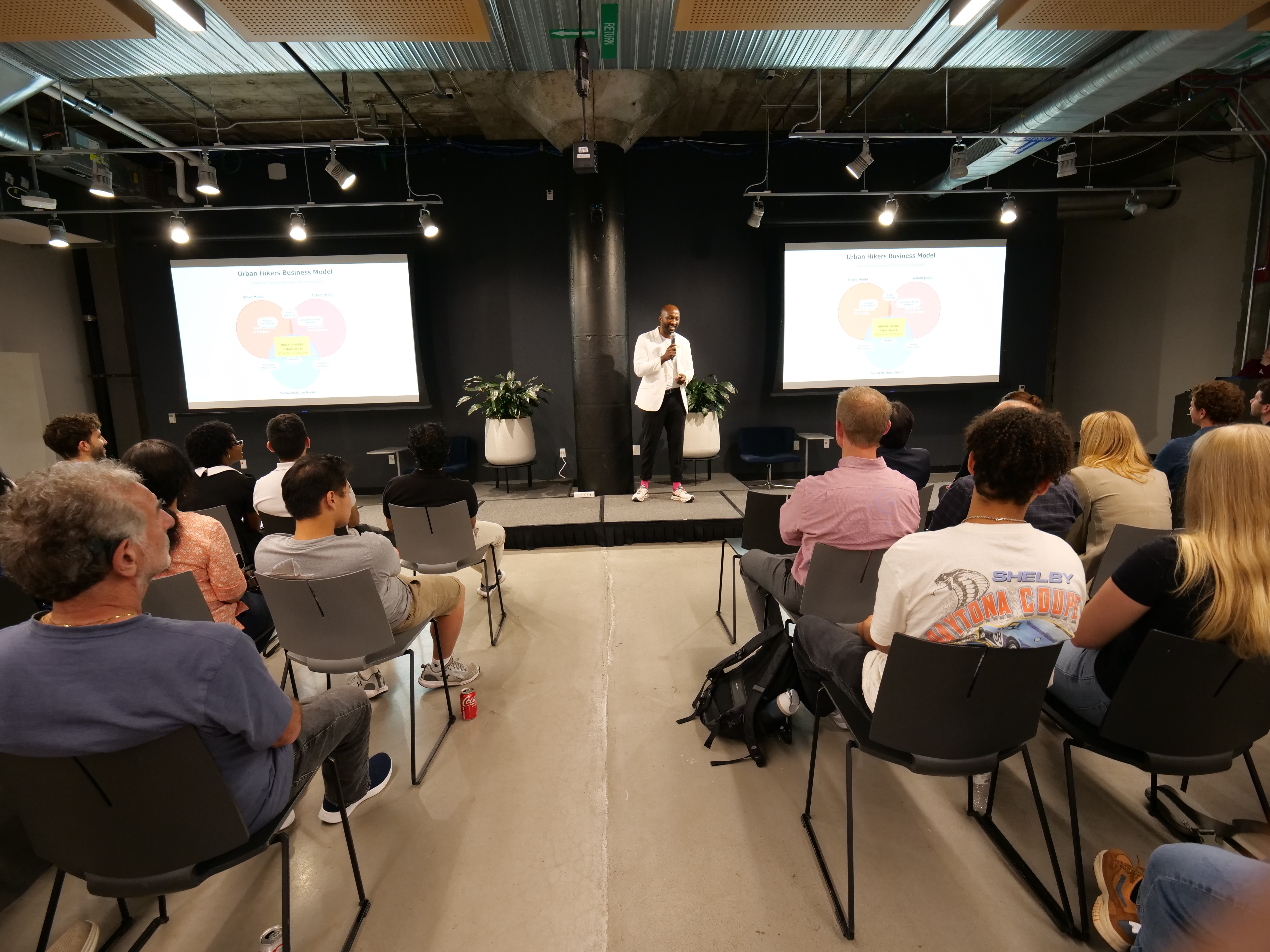 Vanny Mwamba presenting to the audience.