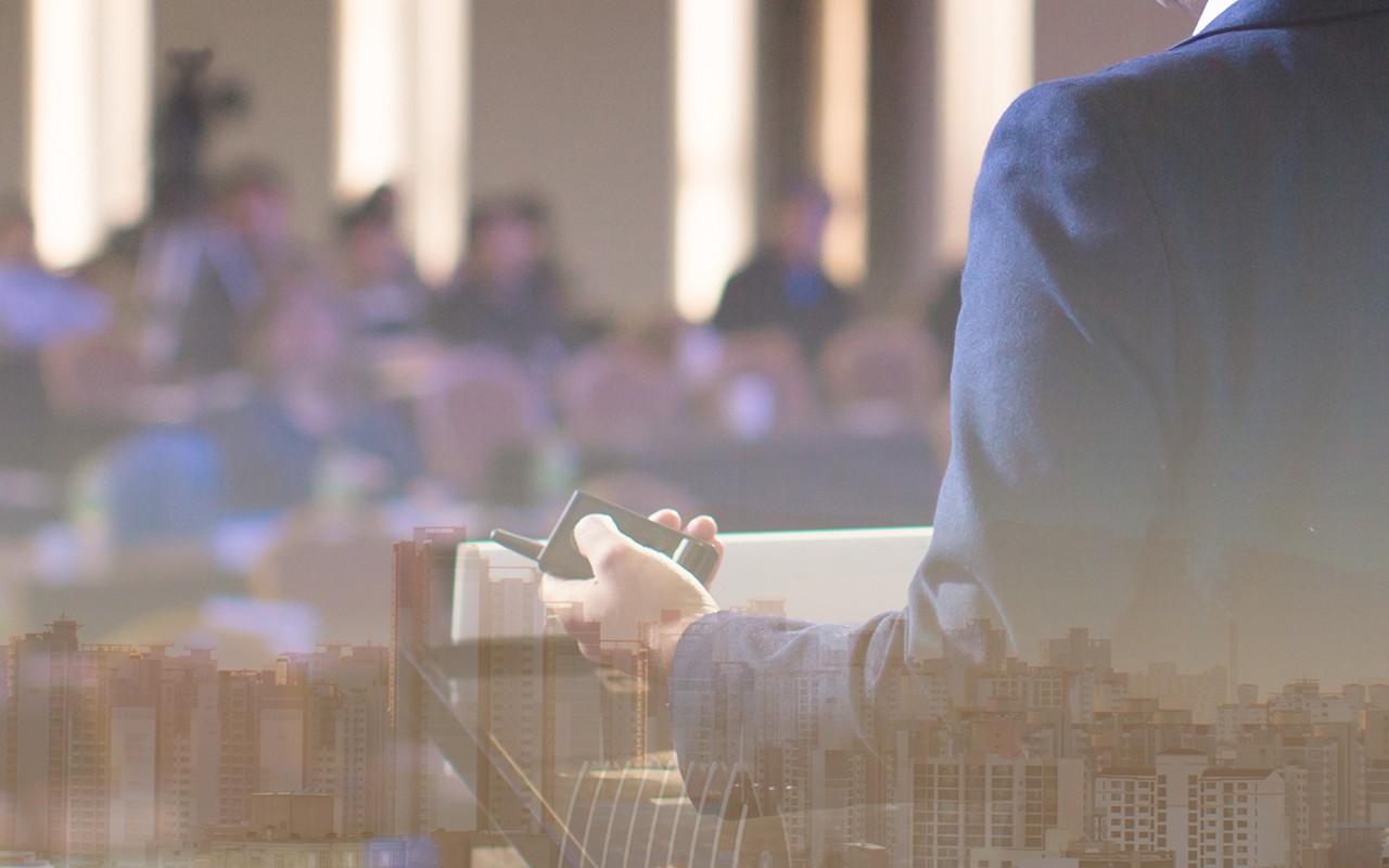 Speaker talking in seminar with audience at business meeting for key of success stock photo. Business seminar stock photo. Confident male leader, coach talking with group of office workers stock photo.