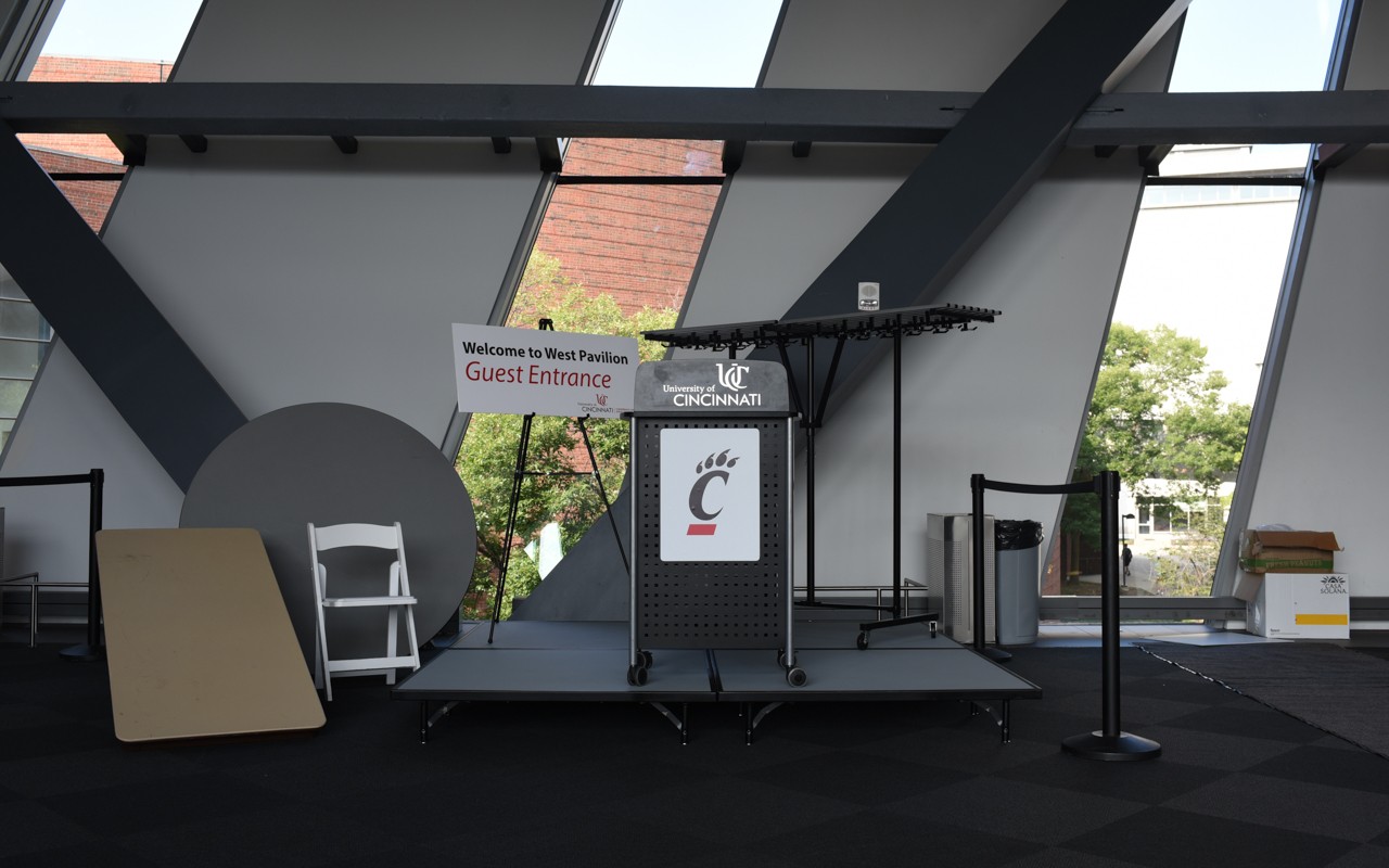 Selection of items available for rent, including chairs, tables, sign holders, podiums, stanchions, coat racks and more.