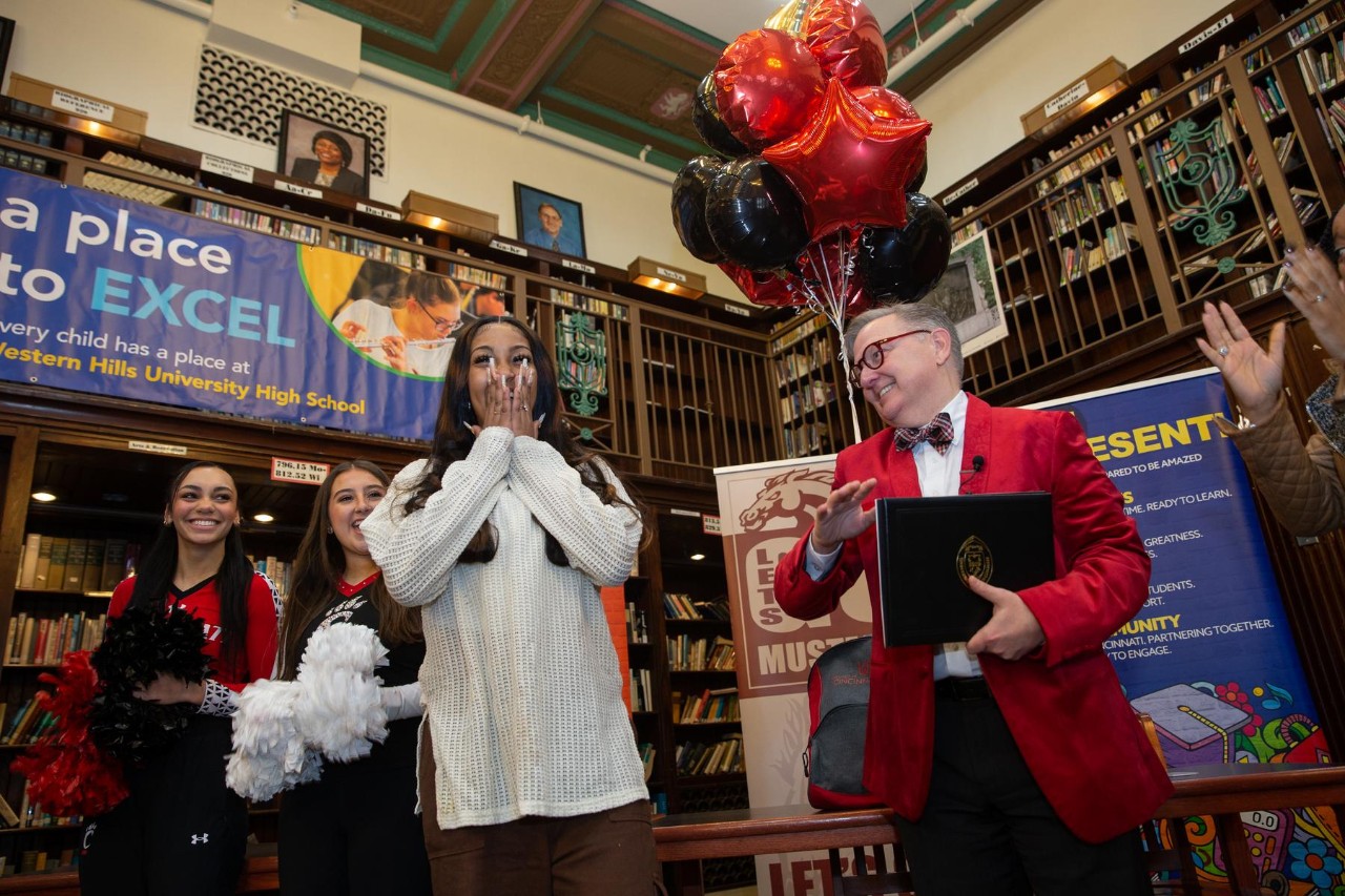 UC surprises Helen Dawit with her acceptance letter and Marian Spencer Scholarship on Decision Day.