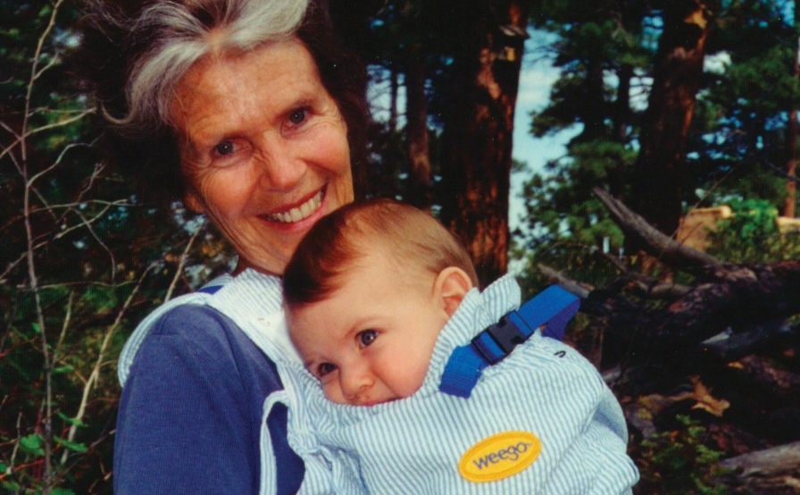 UC Alum Ann Moore modeling a Weego baby holder