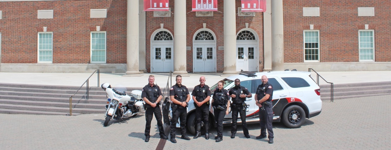 A dispatcher takes a call at a console.