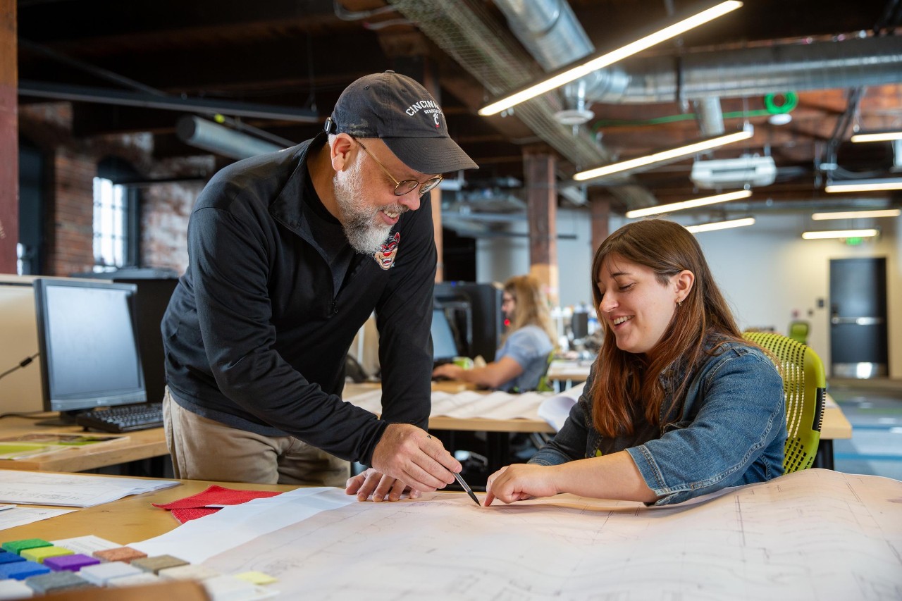 UC student working with co-op employer at her summer internship at an architecture firm