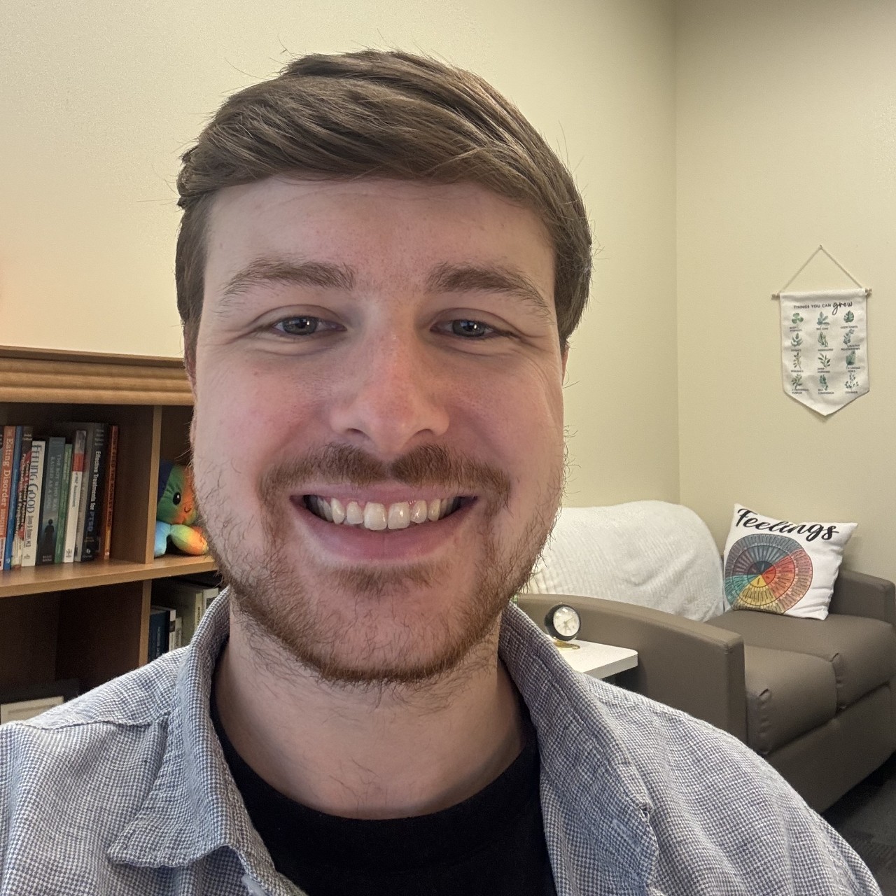 Austin smiling in his office