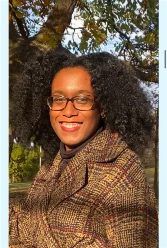 Dylanne outside smiling in the sun