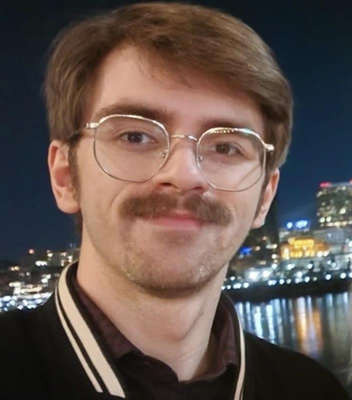 Kobe smiling with the skyline at night