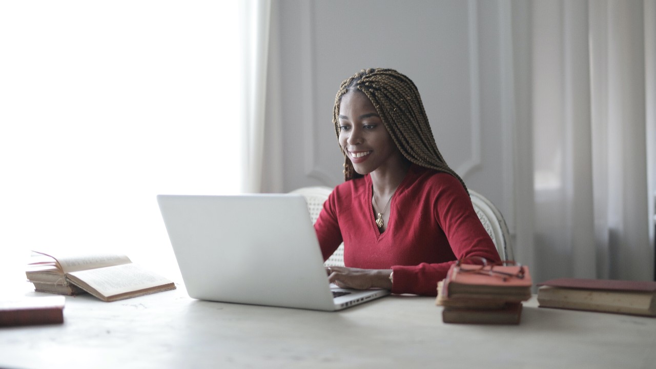 A smiling woman at a computer