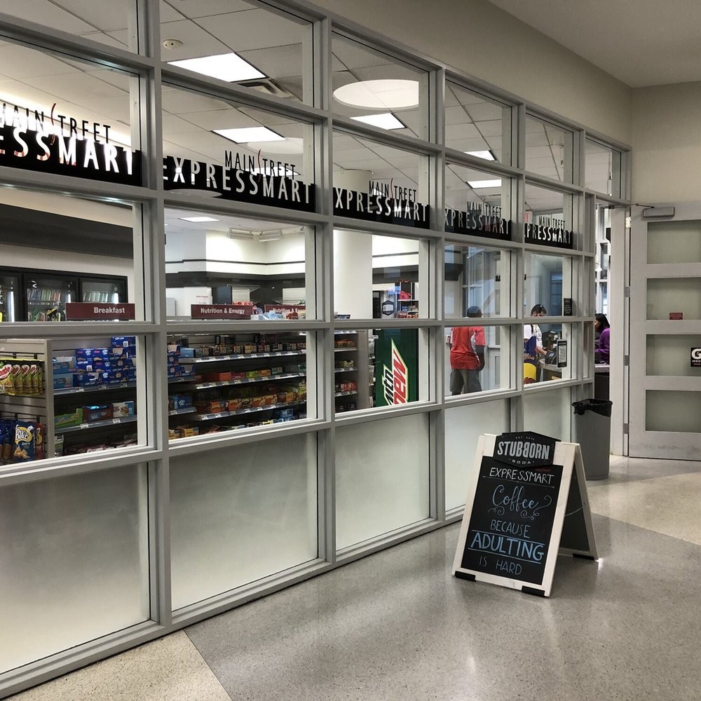 Bearcat mascot and student shopping in MainStreet Expressmart.