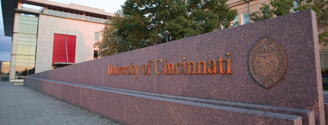 Bronze UC sign on granite background