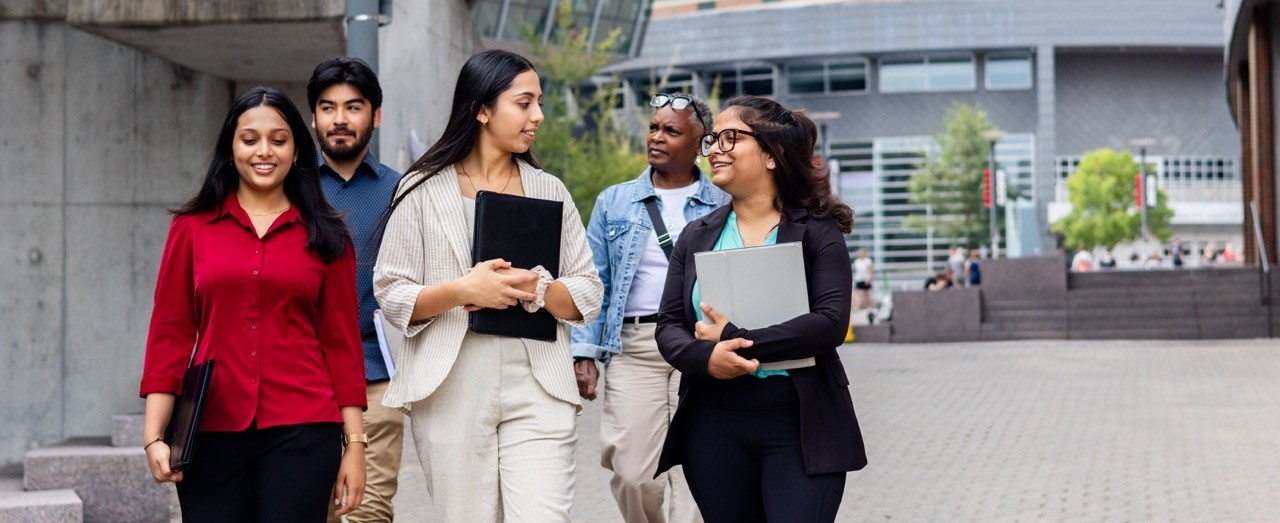 Students walking down main street and talking