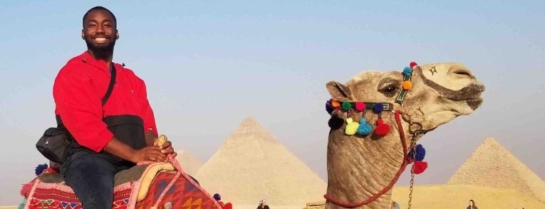 Student on camel on egypt study tour