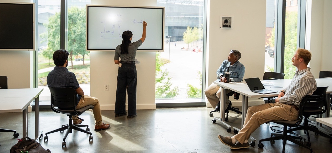 Student presenting to a class on campus