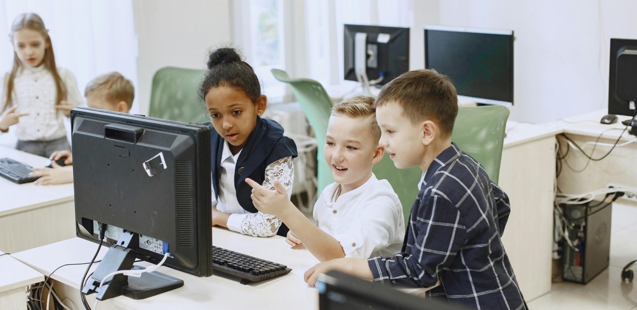 children looking at a computer