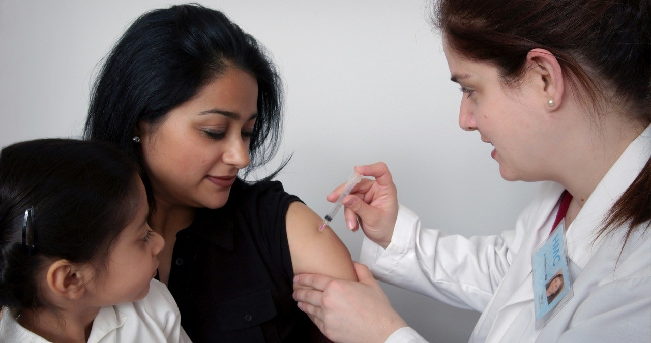 Woman receiving a vaccination