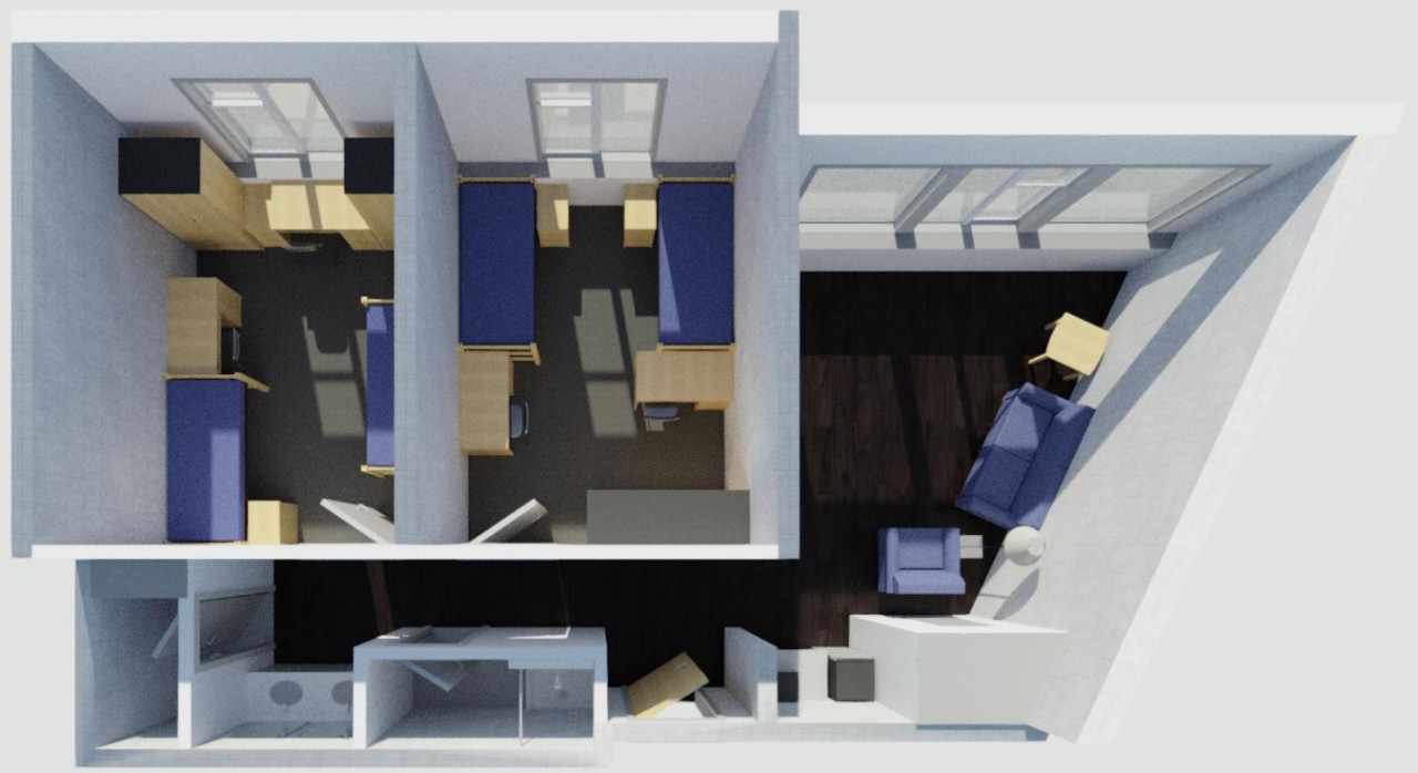 Turner Hall double with 2 bedrooms, each with 2 beds, desks and closets, and a common bathroom and common area with a sofa and chair