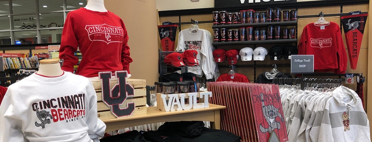 UC-themed apparel and gifts are displayed inside the Tangeman University Center store.