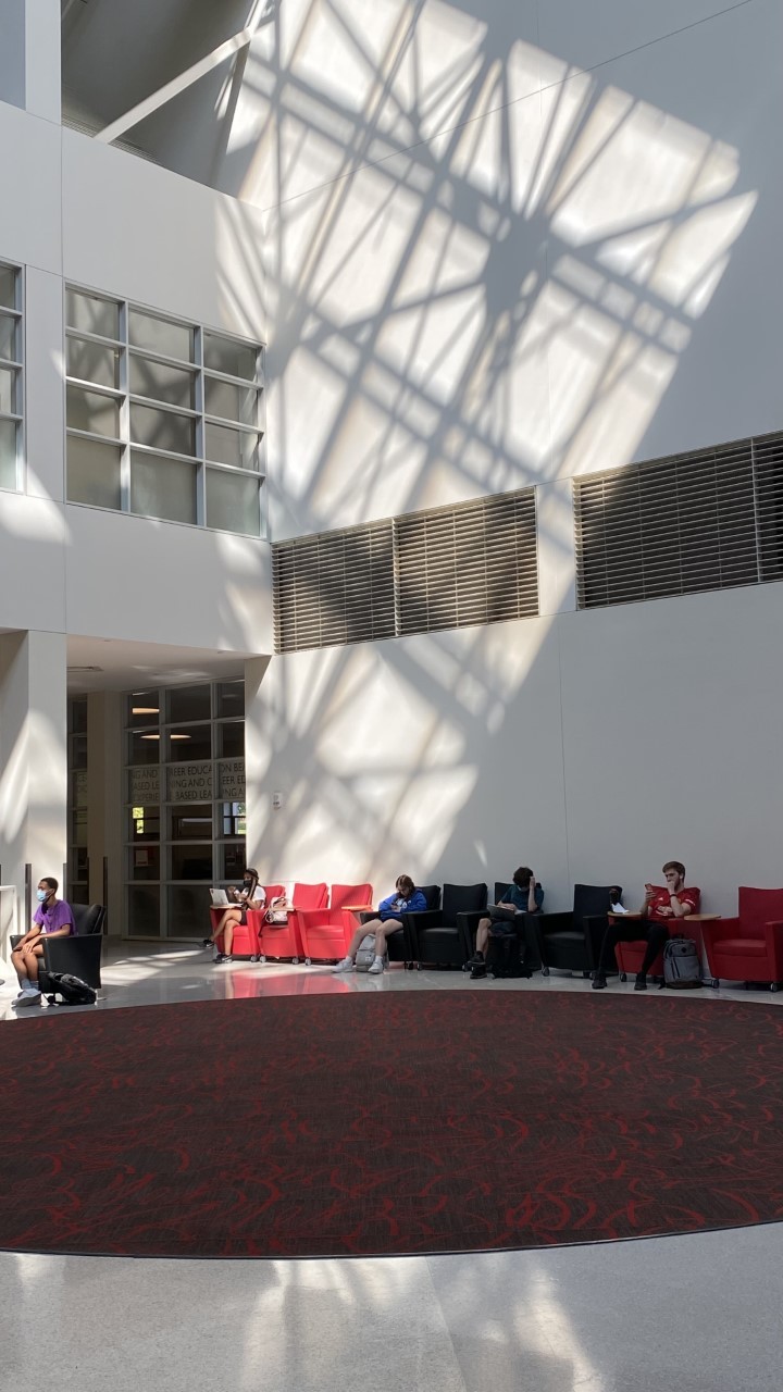 Shadows and sunlight from the ironwork in the clock tower brighten the spacious atrium
