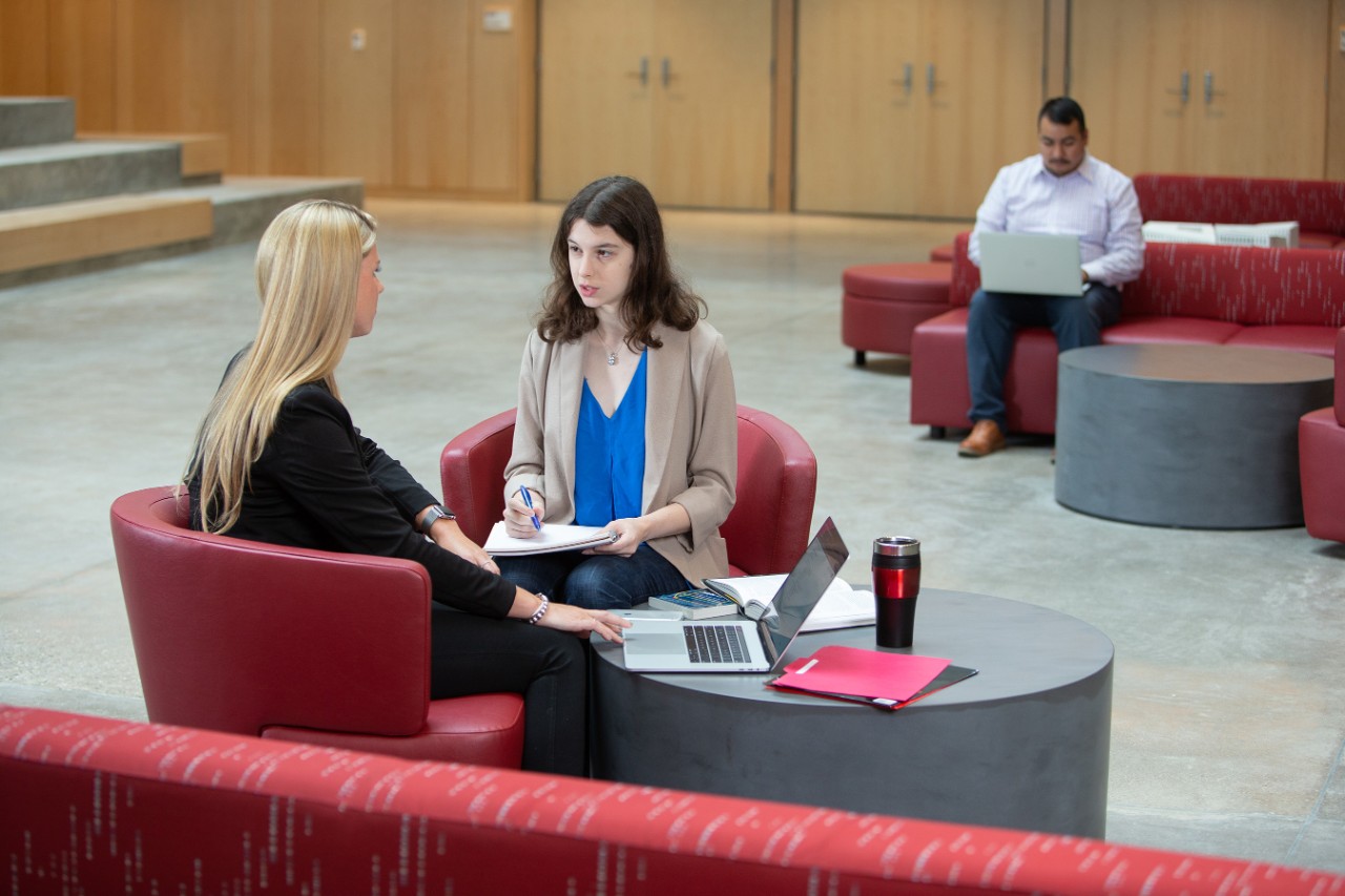 people talking in a lobby