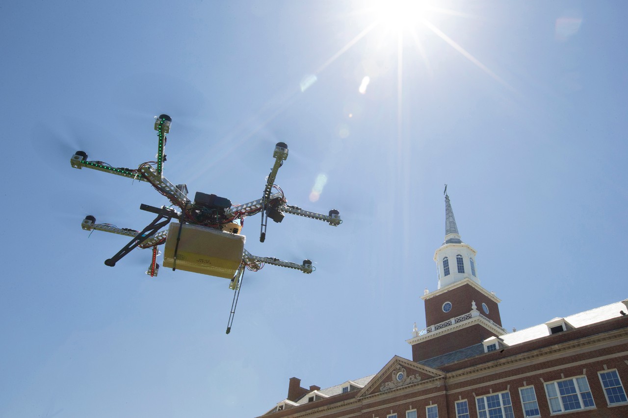 drone flies with Baldwin Hall in background