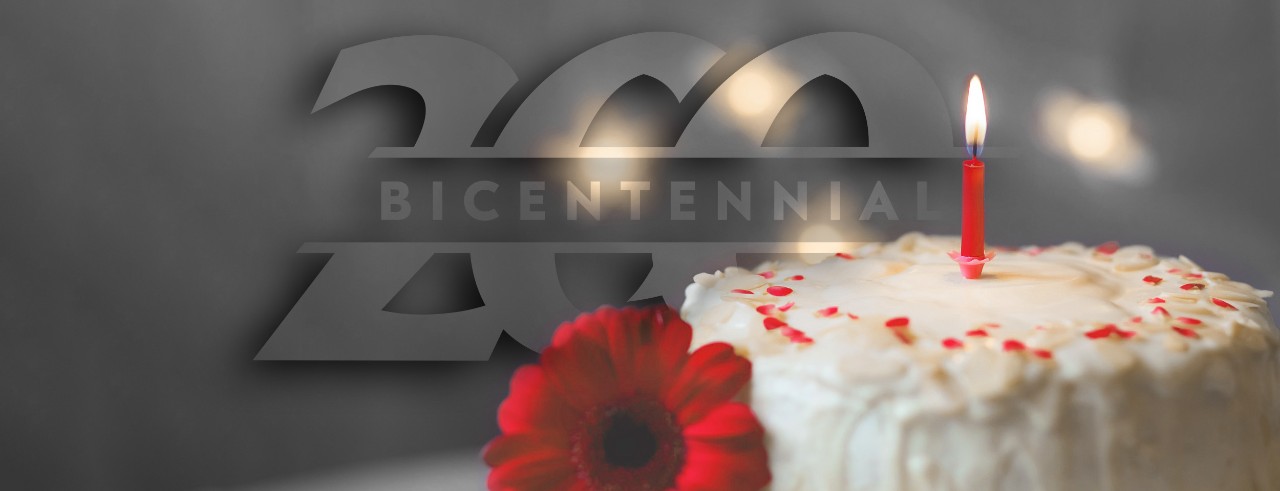 image of cake, a candle and the UC bicentennial logo