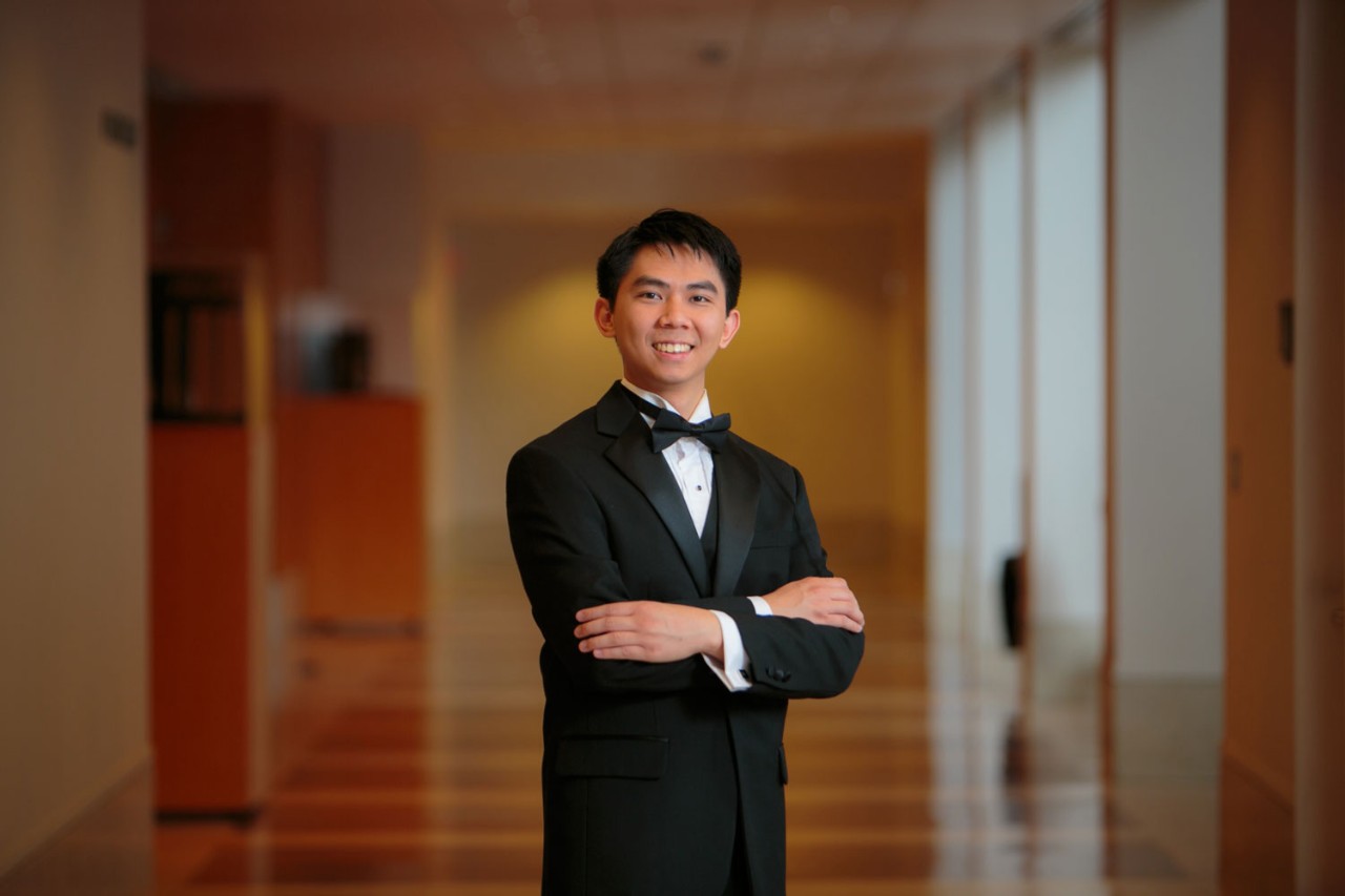 CCM alumnus Jess Leong in the college's atrium.