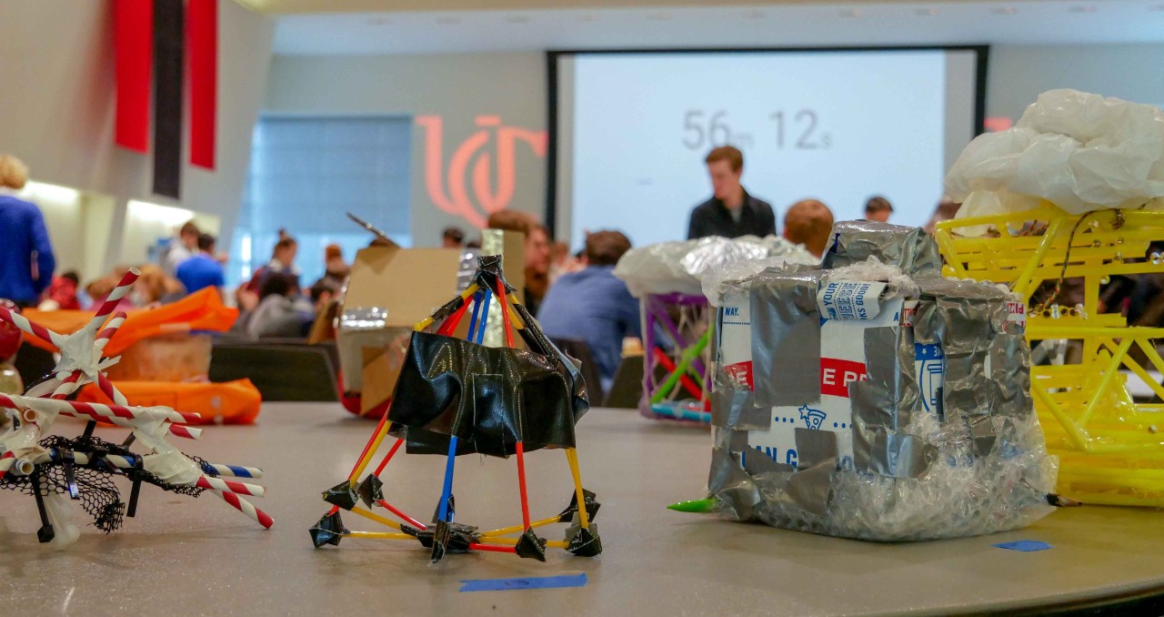 egg drop contraptions displayed on a table