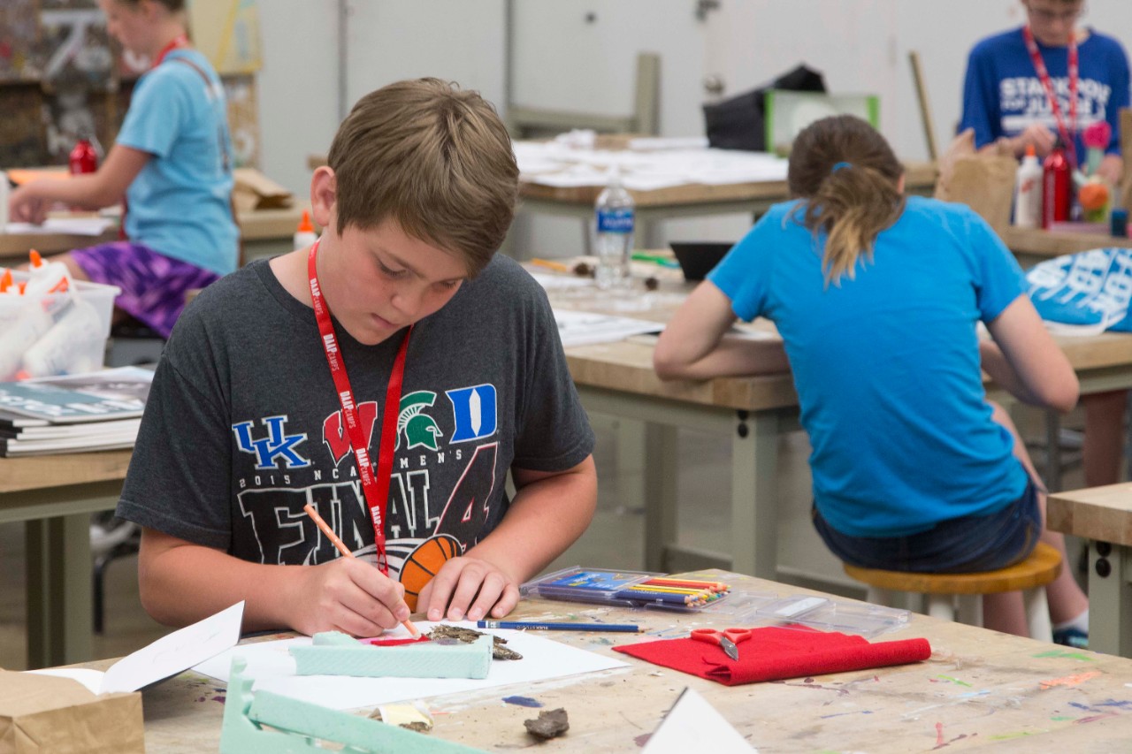 DAAPcamp students work at desks