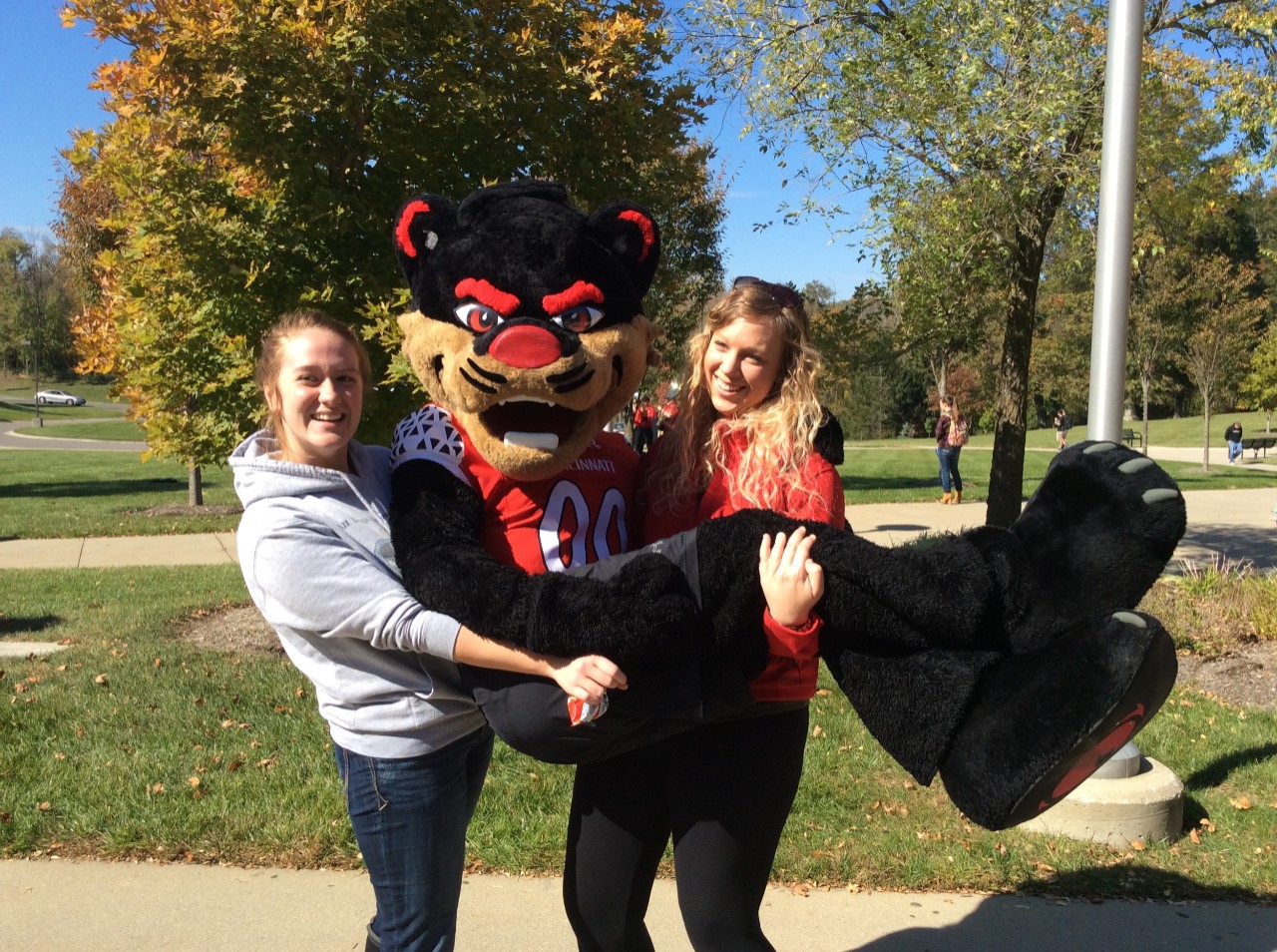 Students holding Bearcat