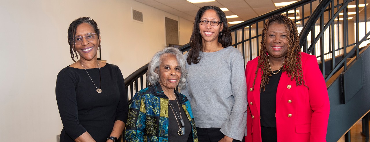 Donna Shambley-Ebron, Jean Anthony, Holly Jones and Adelaide Harris on the spiral staircase in the UC College of Nursing