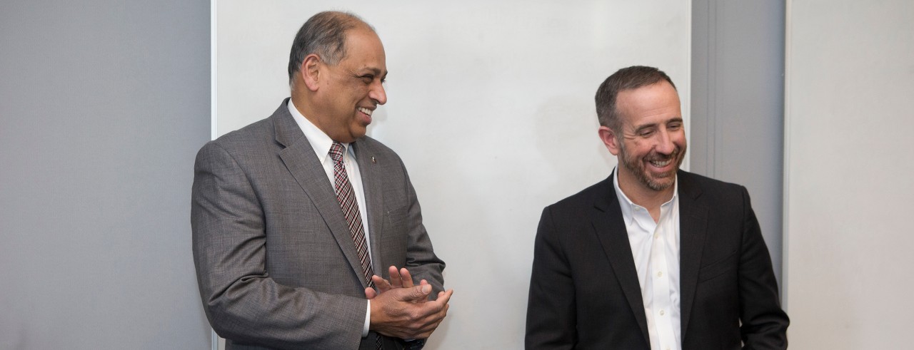 Image of President Neville Pinto with Cincinnati Bell President and CEO Leigh Fox