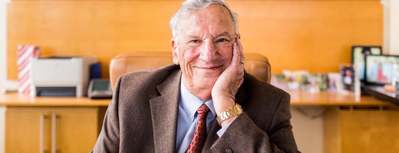 Bill Yung sits at his desk.