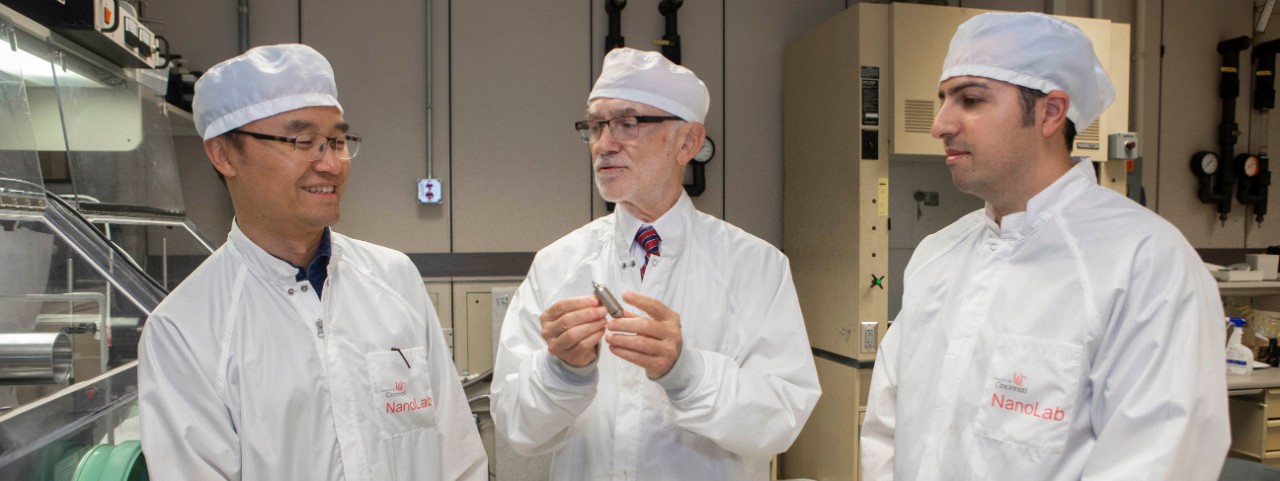 UC professor Andrew Steckl works with UC senior research associate Daewoo Han, left, and Turkish researcher Serdar Tort.