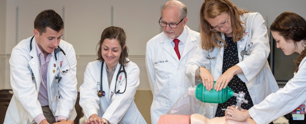photo of Dean Andrew Filak wit medical students